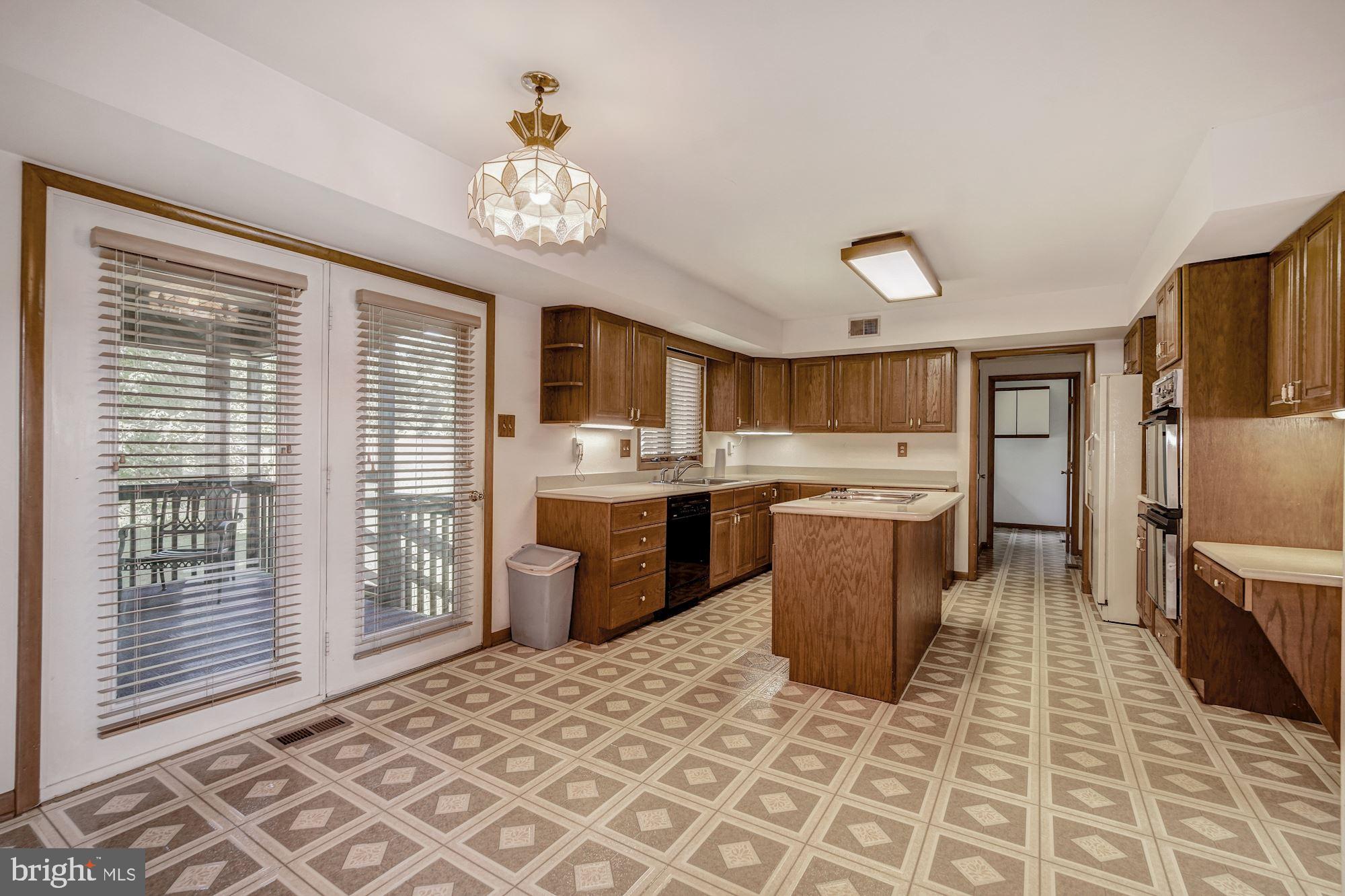 21 Ringfield Road Chadds Ford, PA 19317 - Photo 20 of 35 Kitchen with door to screened-in porch