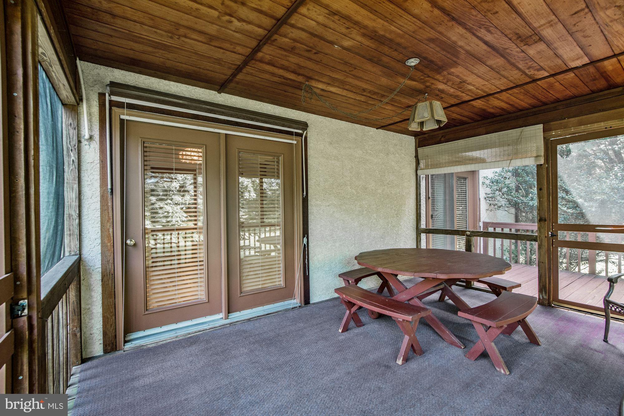 21 Ringfield Road Chadds Ford, PA 19317 - Photo 8 of 35 Porch sliders into breakfast area