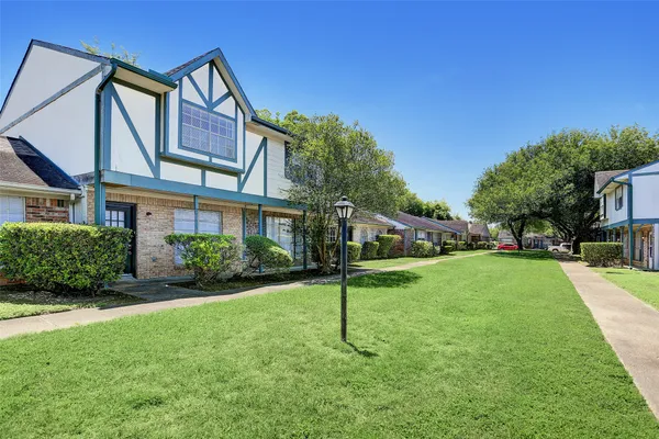 a house view with a garden space