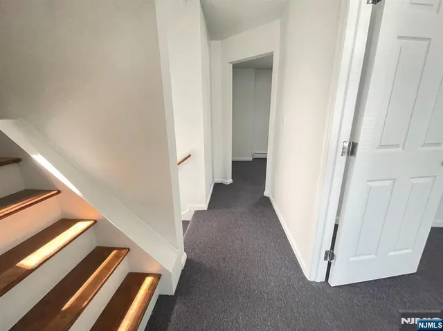 a view of a hallway with staircase