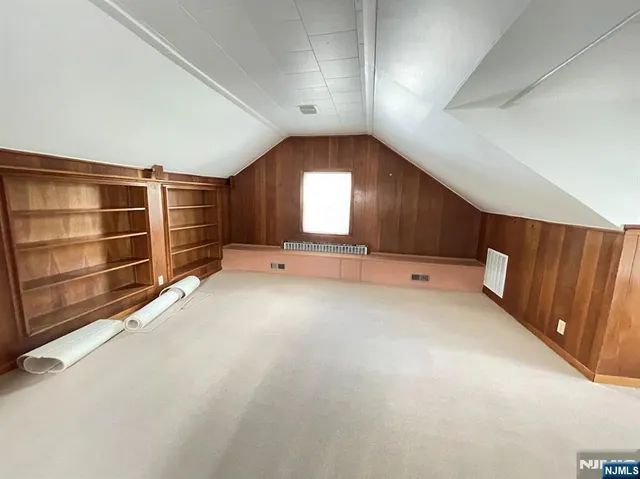 a view of room with window and wooden floor