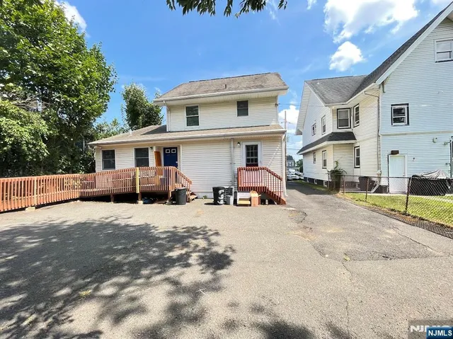 a view of a yard with cars