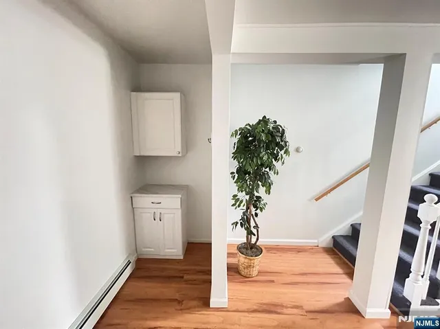 a view of entryway with wooden floor