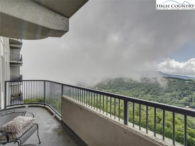 a view of balcony with furniture