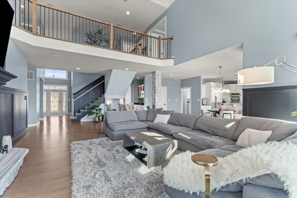 a living room with lots of furniture and kitchen view
