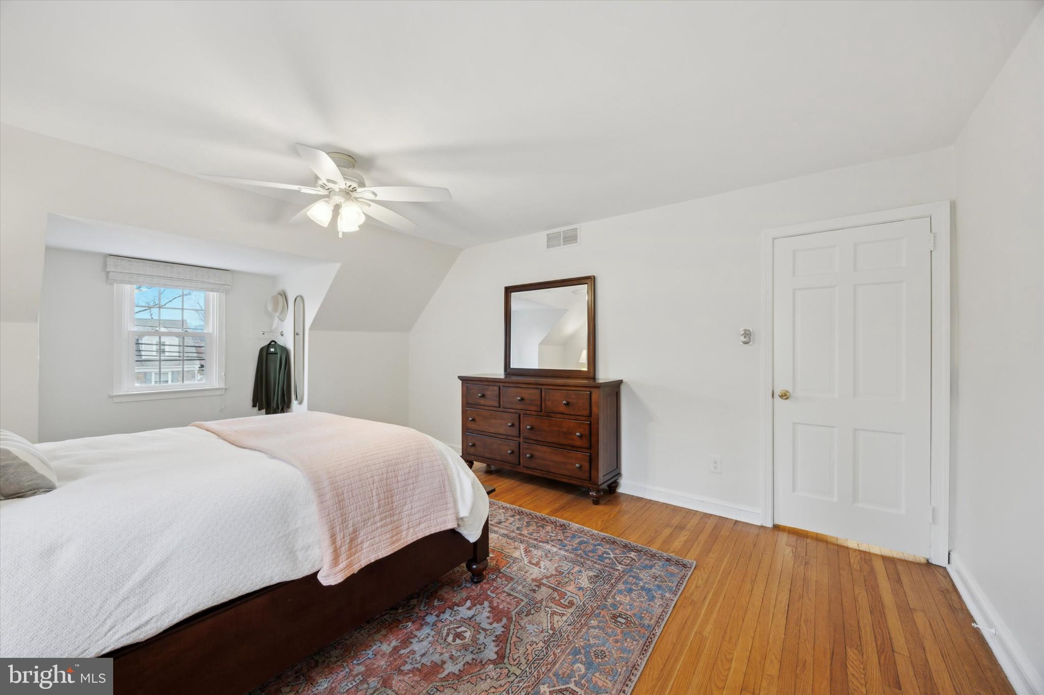 40 Providence Road Morton, PA 19070 - Photo 23 of 34 a bedroom with a large bed and a chandelier