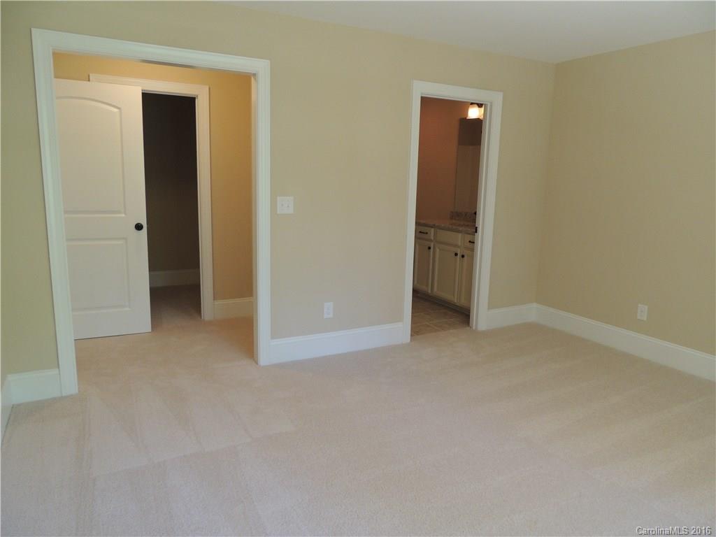 905 Ospre Lane, Unit 142 Fort Mill, SC 29708 - Photo 19 of 24 an empty room with closet and a bathroom