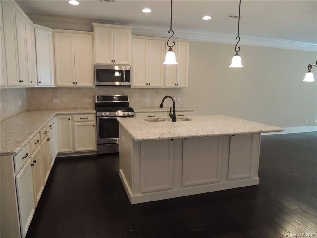 905 Ospre Lane, Unit 142 Fort Mill, SC 29708 - Photo 4 of 24 a kitchen with a sink appliances and cabinets