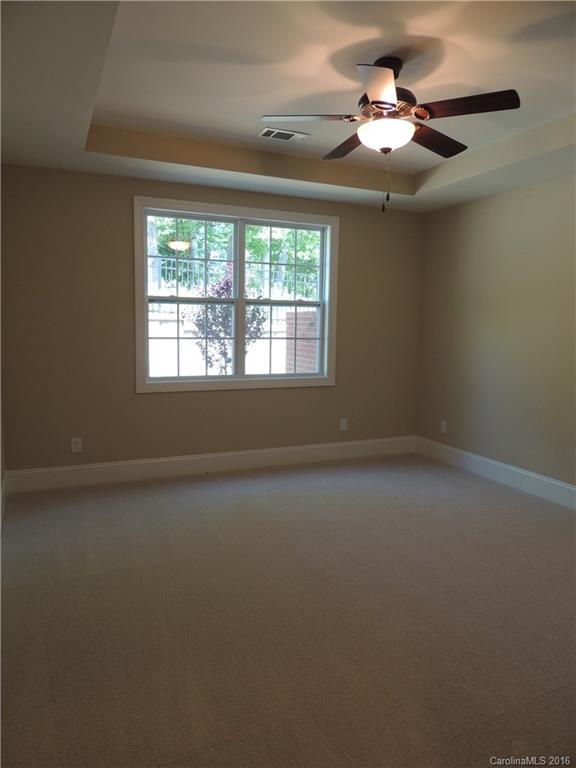 905 Ospre Lane, Unit 142 Fort Mill, SC 29708 - Photo 9 of 24 an empty room with a window