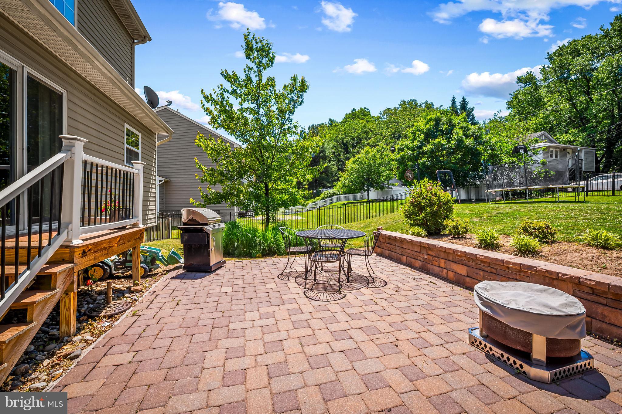 6008 Hanover Road Elkridge, MD 21075 - Photo 35 of 36 a view of a patio with a table and chairs and potted plants