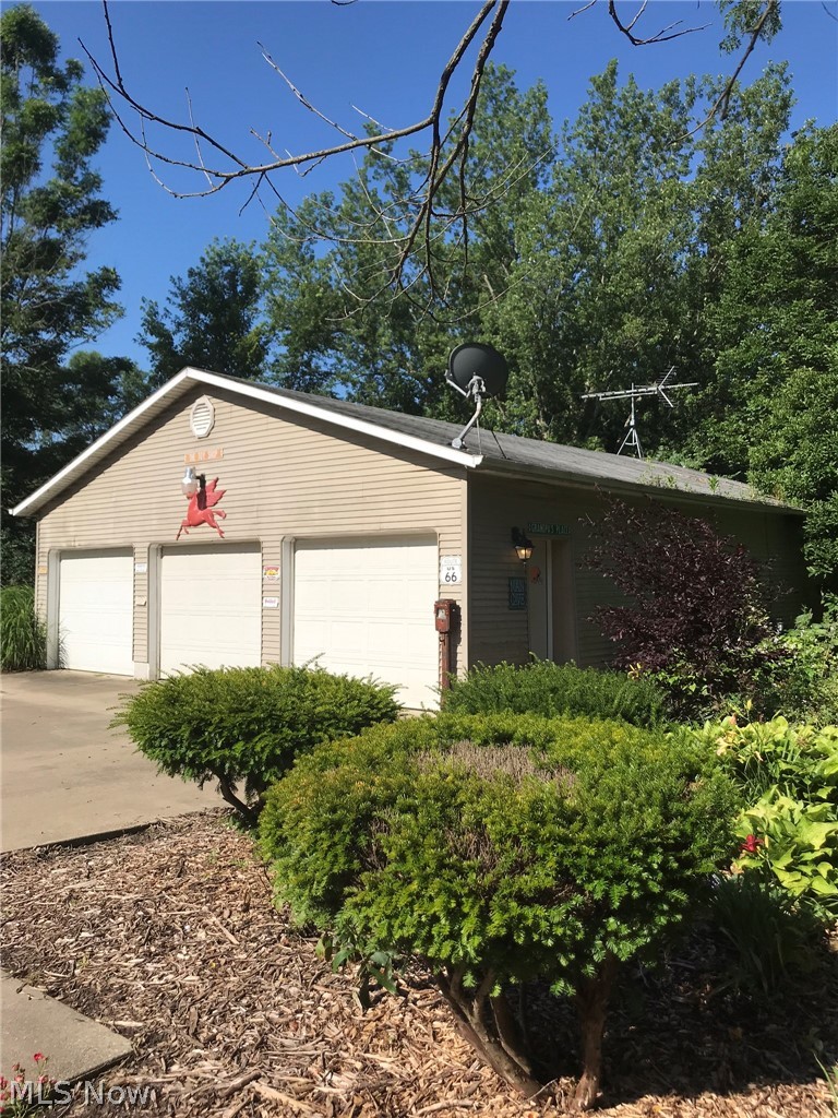 3261 Biltz Road Kent, OH 44240 - Photo 24 of 28 Three bay mechanic workshop with car/truck lift rated 6000#. Radiant heat and heated floor, half bath and sizable parking area...fantastic opportunity for mechanic business or for antique car lover!
