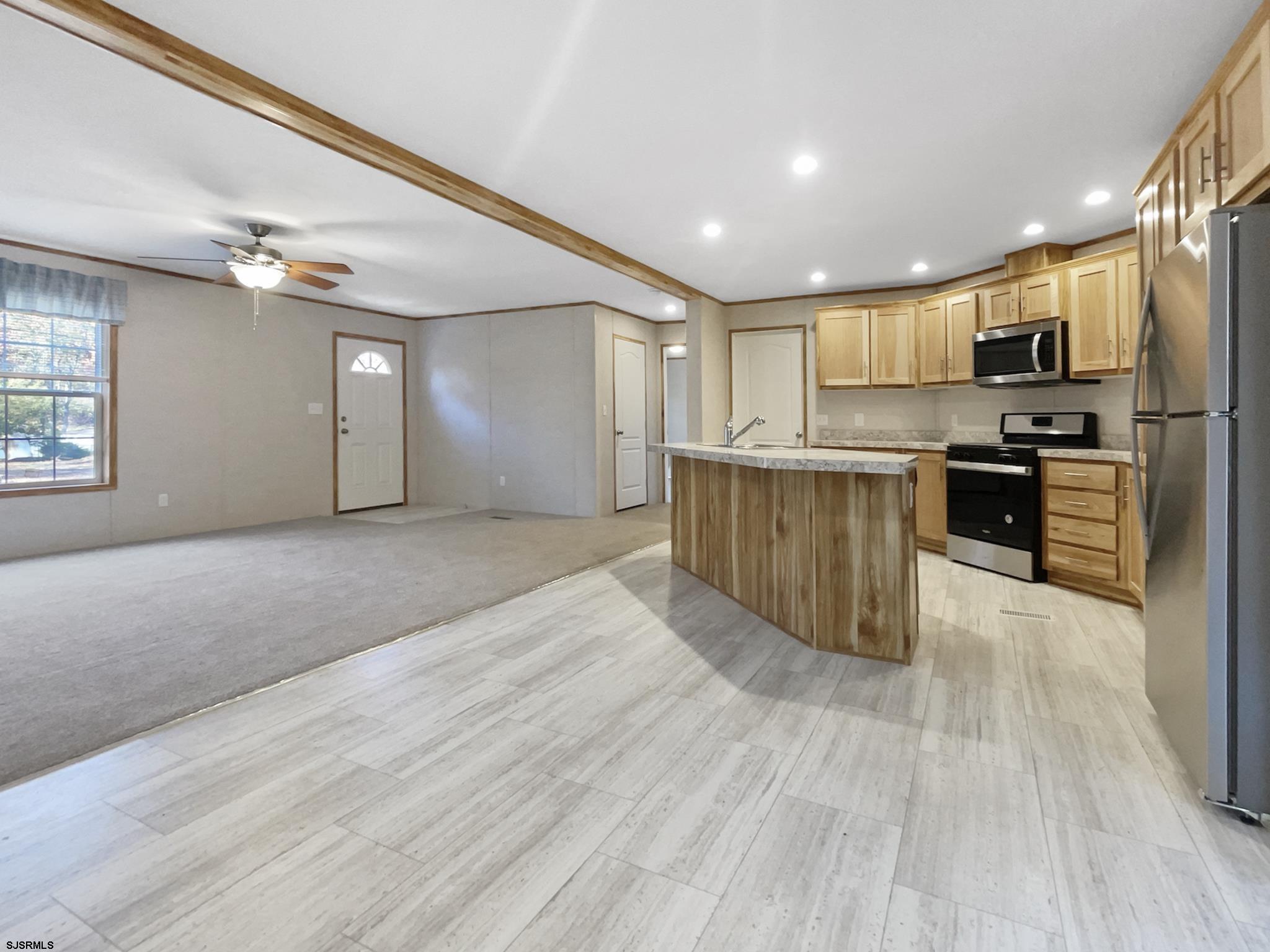 240 Mist Road Millville, NJ 08332 - Photo 11 of 48 a view of kitchen with kitchen island granite countertop wooden floor stainless steel appliances and cabinets