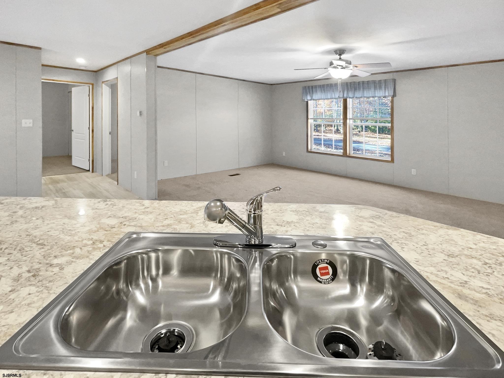 240 Mist Road Millville, NJ 08332 - Photo 14 of 48 a close view of sink and tap
