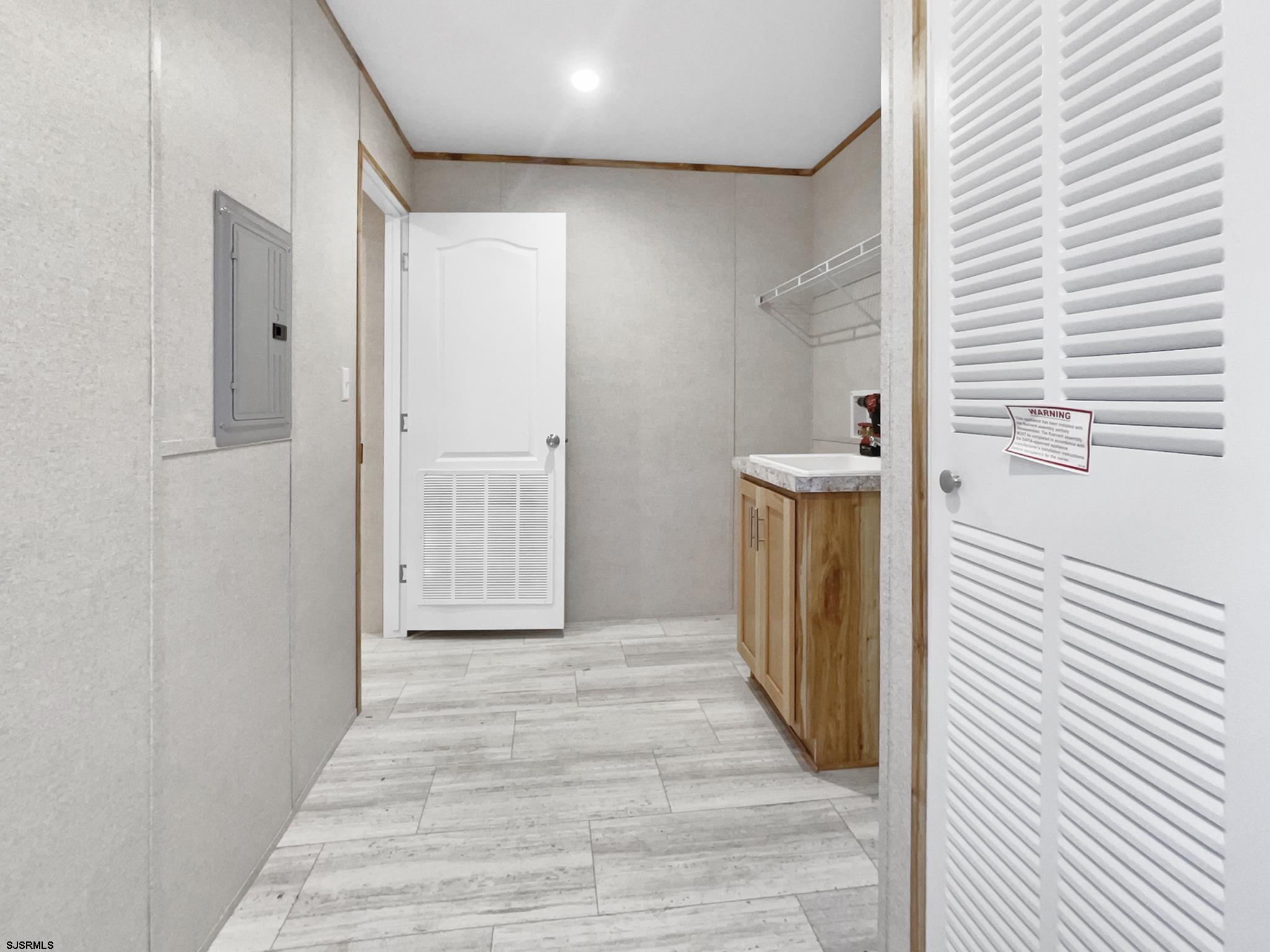 240 Mist Road Millville, NJ 08332 - Photo 15 of 48 a view of a hallway with wooden floor and staircase