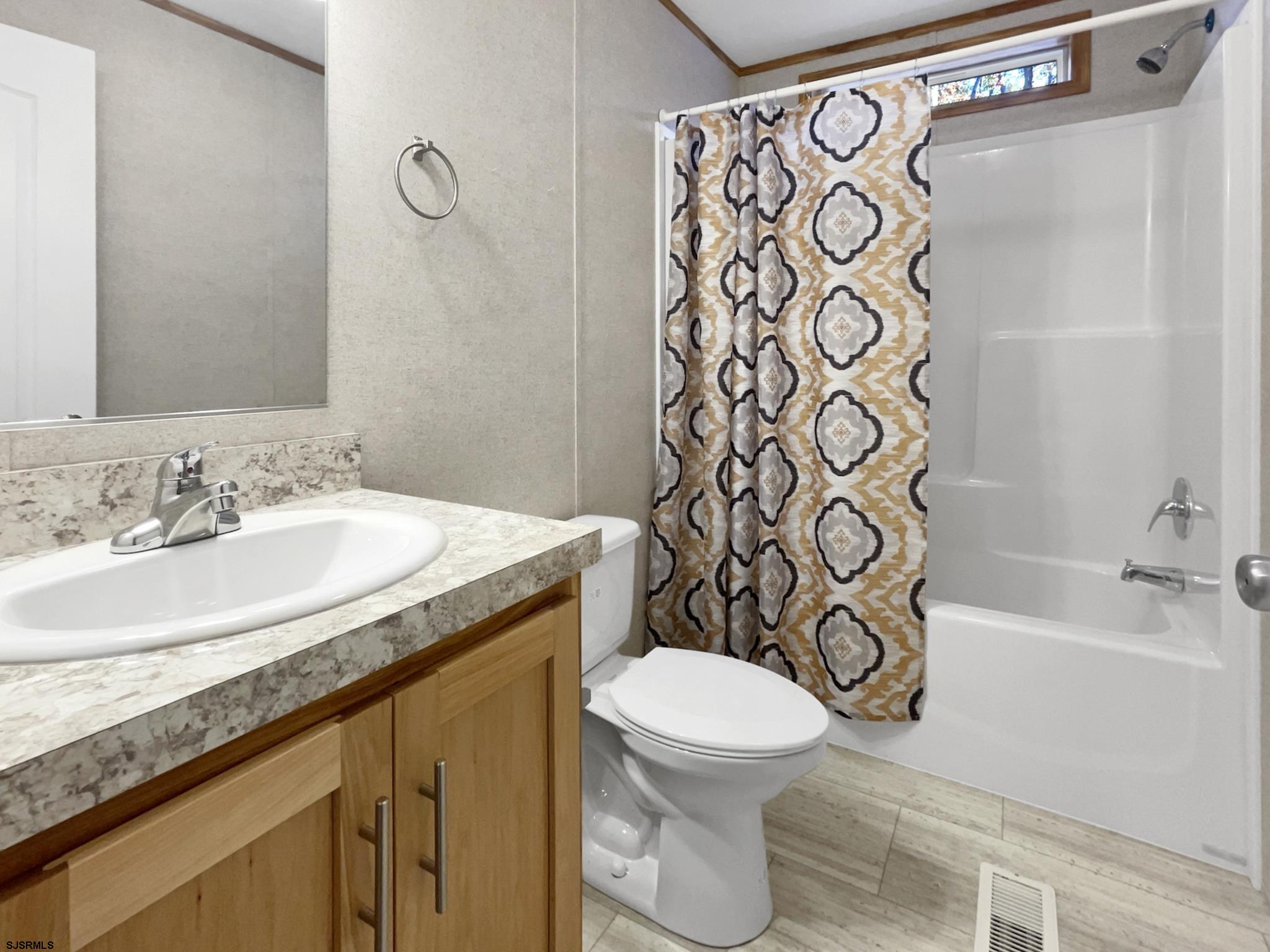 240 Mist Road Millville, NJ 08332 - Photo 17 of 48 a bathroom with a sink and a toilet
