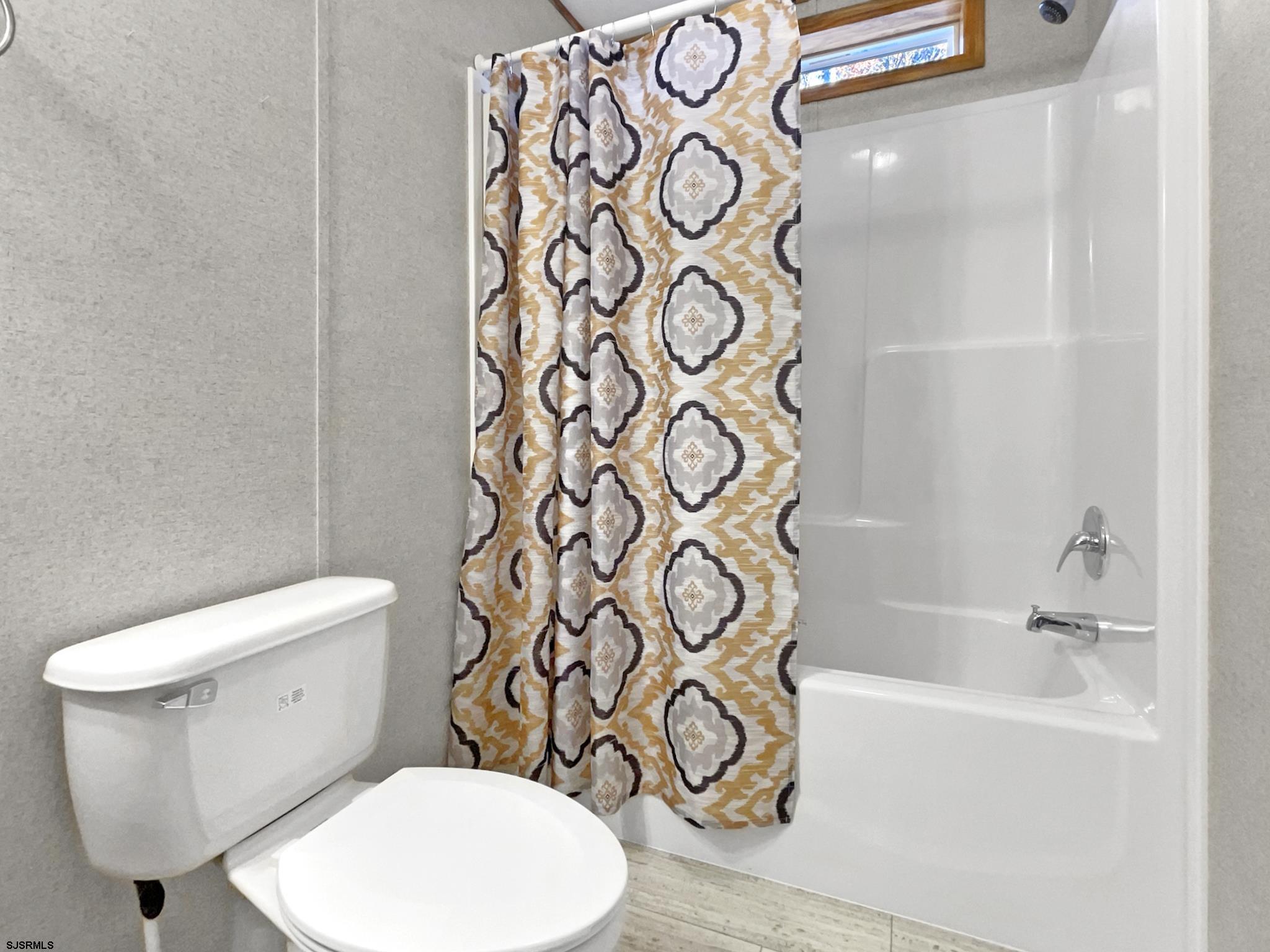 240 Mist Road Millville, NJ 08332 - Photo 18 of 48 a white toilet sitting next to a bathroom sink
