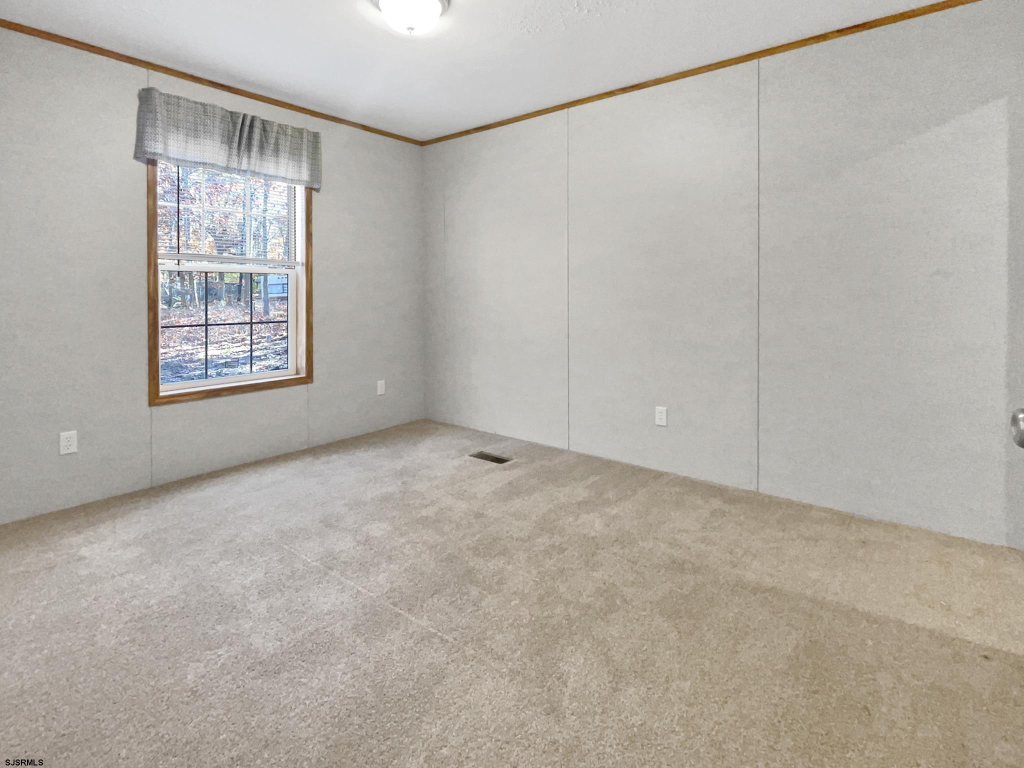 240 Mist Road Millville, NJ 08332 - Photo 21 of 48 a view of an empty room with a window