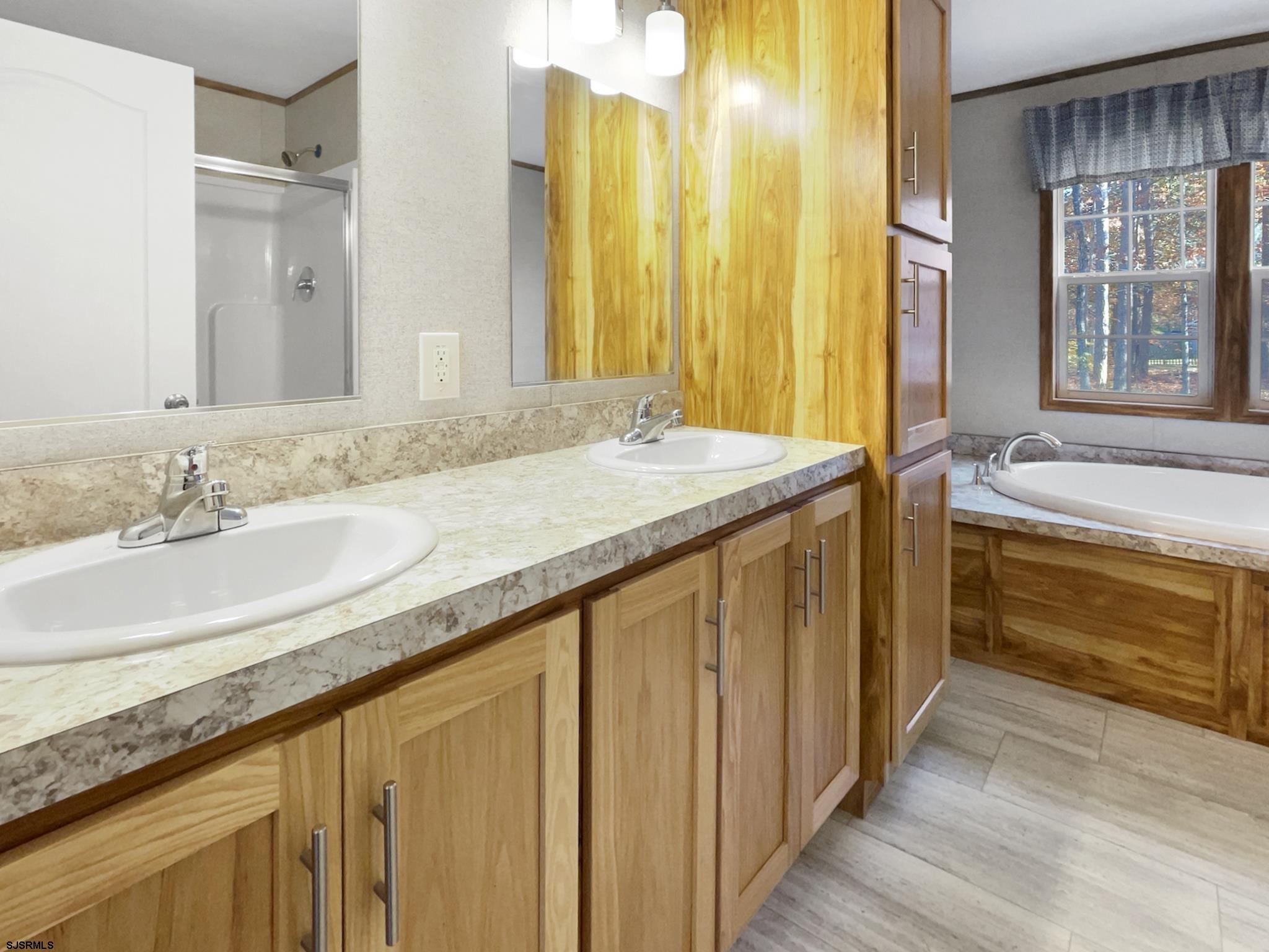 240 Mist Road Millville, NJ 08332 - Photo 24 of 48 a bathroom with a granite countertop sink and a large mirror