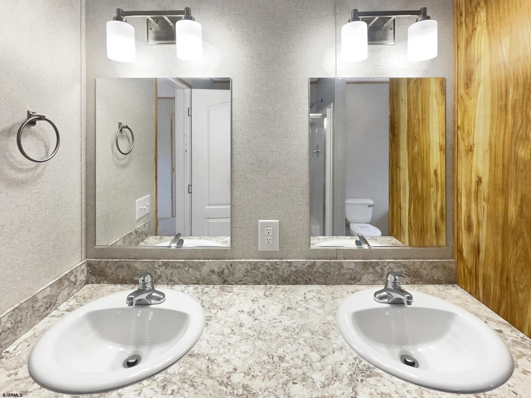 240 Mist Road Millville, NJ 08332 - Photo 25 of 48 a bathroom with a sink and a mirror