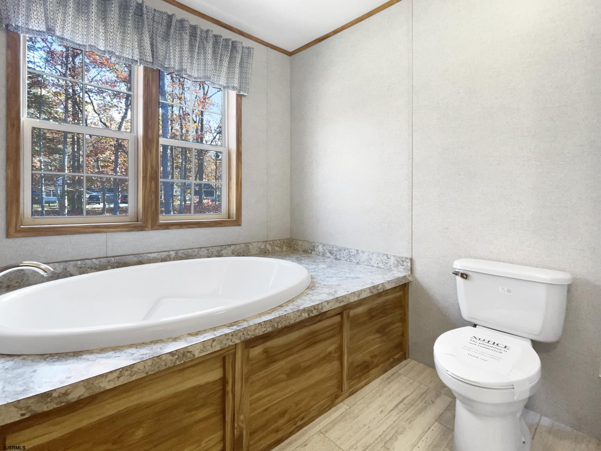 240 Mist Road Millville, NJ 08332 - Photo 31 of 48 a bathroom with a granite countertop sink and a bathtub