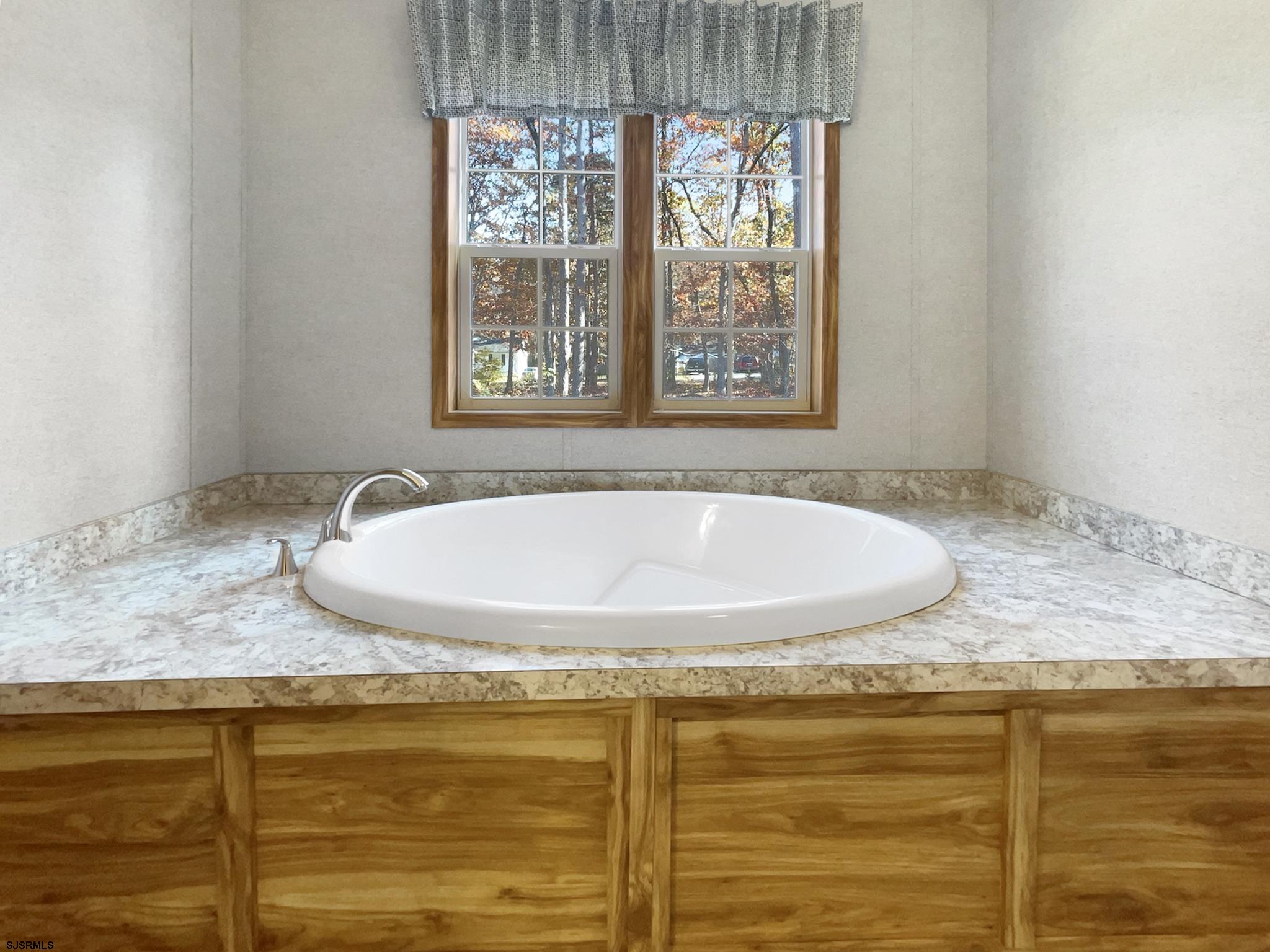 240 Mist Road Millville, NJ 08332 - Photo 35 of 48 a bathroom with a granite countertop sink and window
