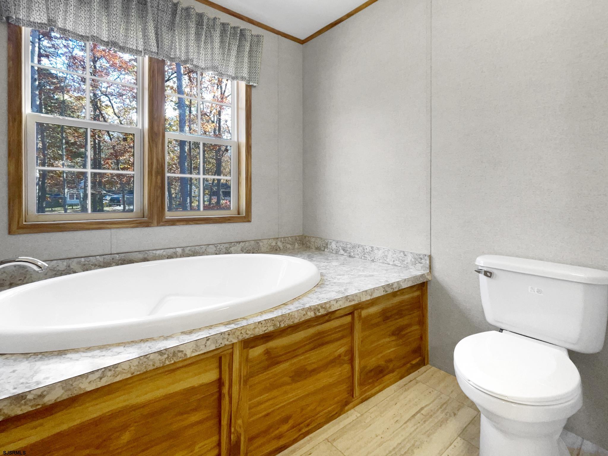 240 Mist Road Millville, NJ 08332 - Photo 37 of 48 a bath room with a toilet and a bath tub