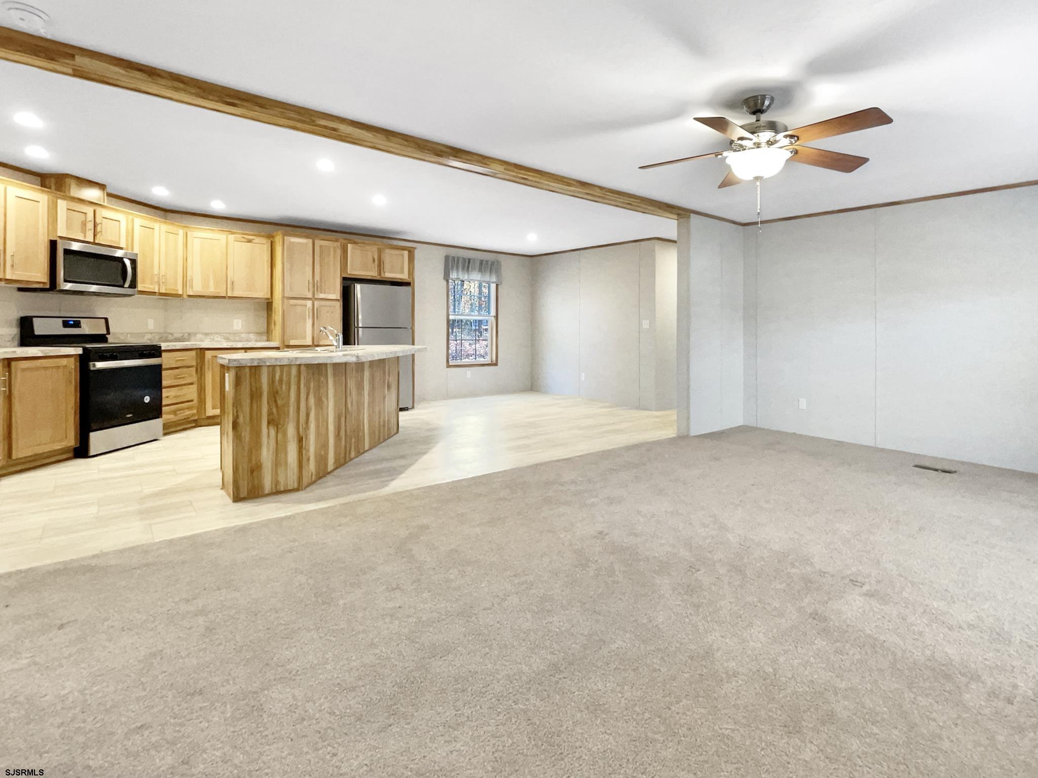 240 Mist Road Millville, NJ 08332 - Photo 5 of 48 a view of a kitchen with a sink and microwave