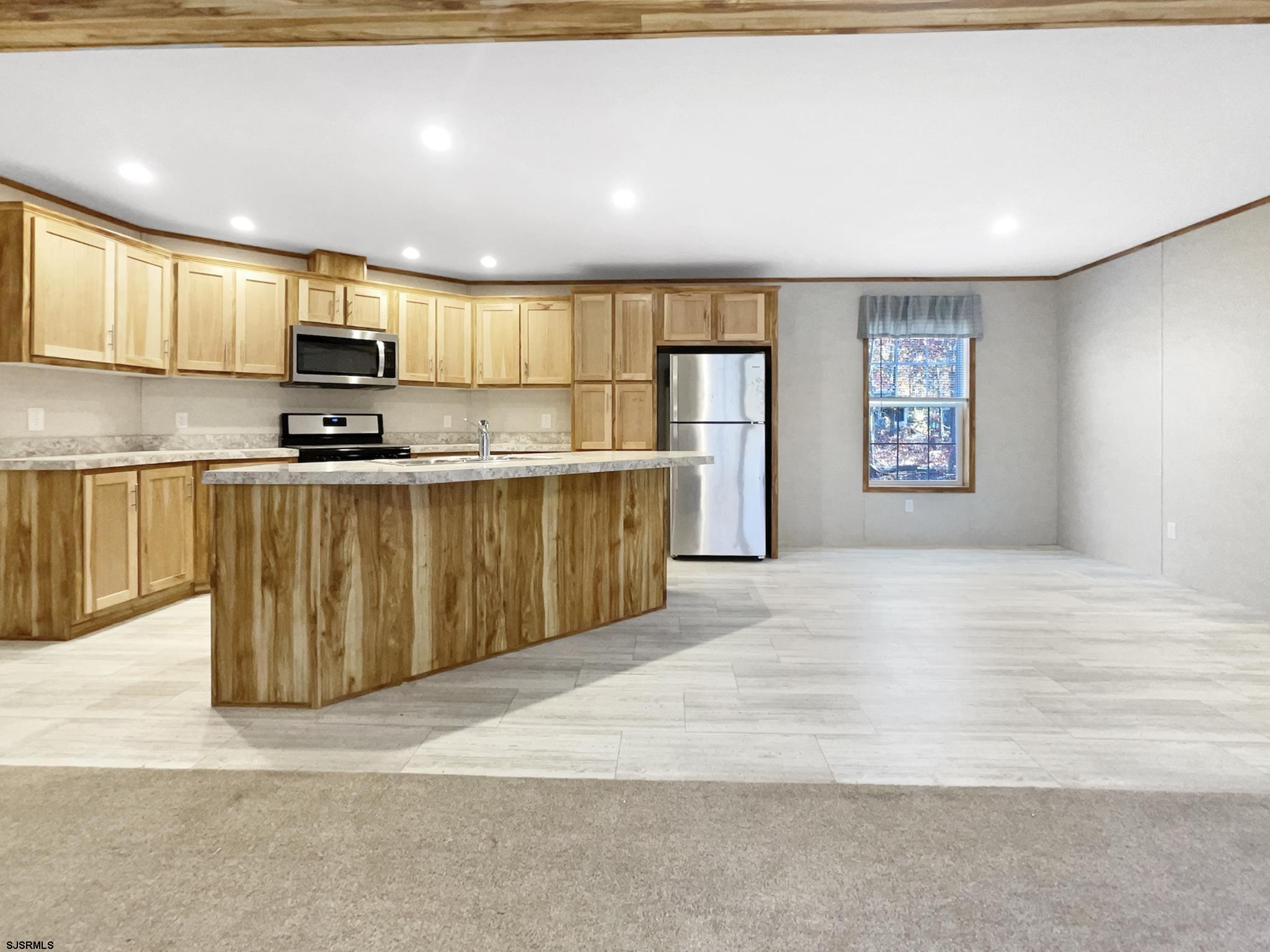 240 Mist Road Millville, NJ 08332 - Photo 7 of 48 a large kitchen with stainless steel appliances granite countertop a stove a sink dishwasher and a refrigerator