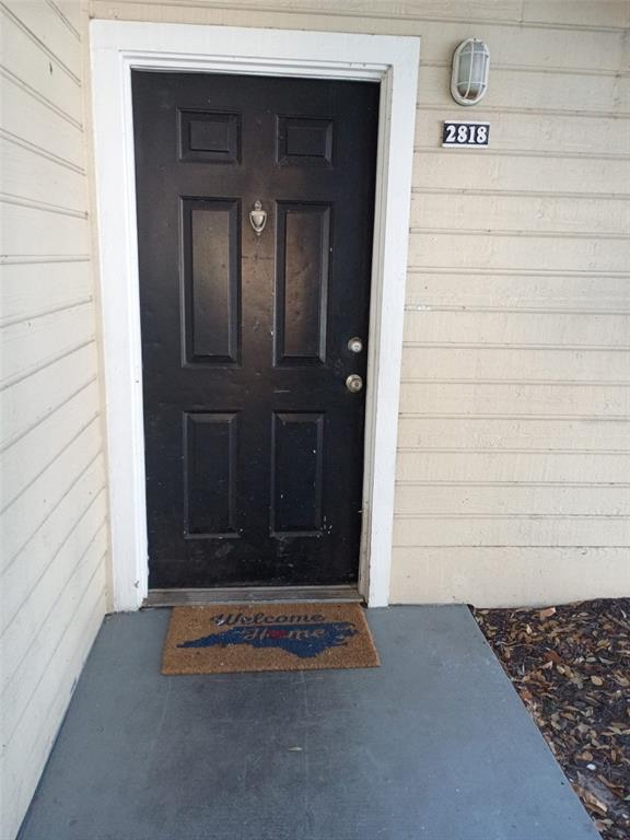 1037 South Hiawassee Road, Unit 2818 Orlando, FL 32835 - Photo 4 of 11 a view of entryway front of a house