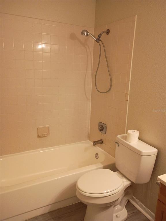 1037 South Hiawassee Road, Unit 2818 Orlando, FL 32835 - Photo 5 of 11 a bathroom with a toilet and a shower