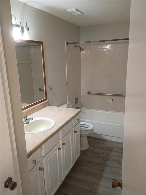 1037 South Hiawassee Road, Unit 2818 Orlando, FL 32835 - Photo 7 of 11 a bathroom with a granite countertop sink toilet and shower