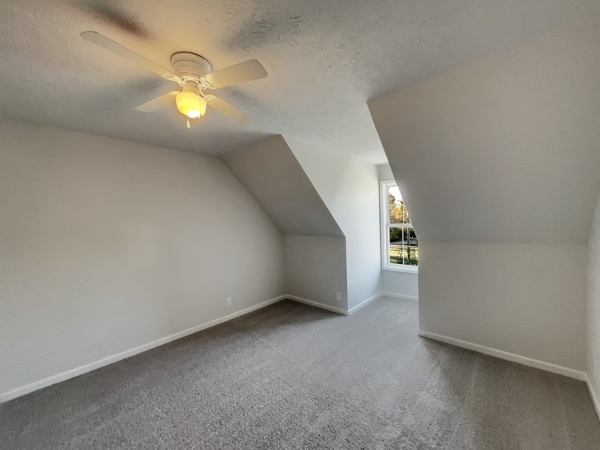 1837 Twin Rivers Road Clarksville, TN 37040 - Photo 11 of 19 a view of an empty room with a chandelier fan and window