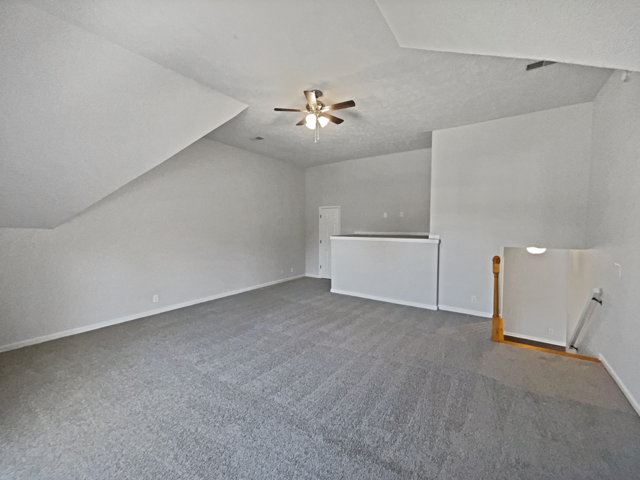 1837 Twin Rivers Road Clarksville, TN 37040 - Photo 12 of 19 a view of an empty room with a ceiling fan and kitchen view