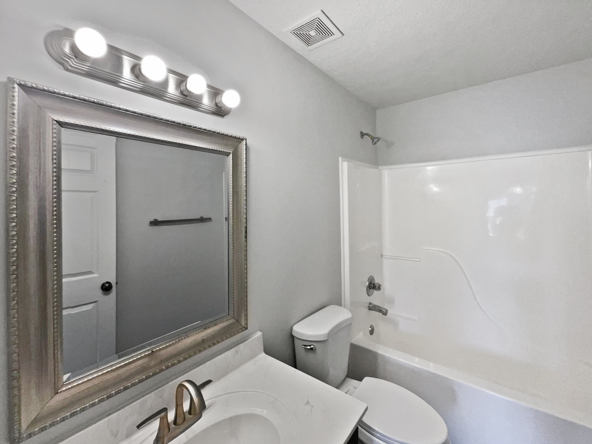 1837 Twin Rivers Road Clarksville, TN 37040 - Photo 13 of 19 a bathroom with a sink a toilet and shower