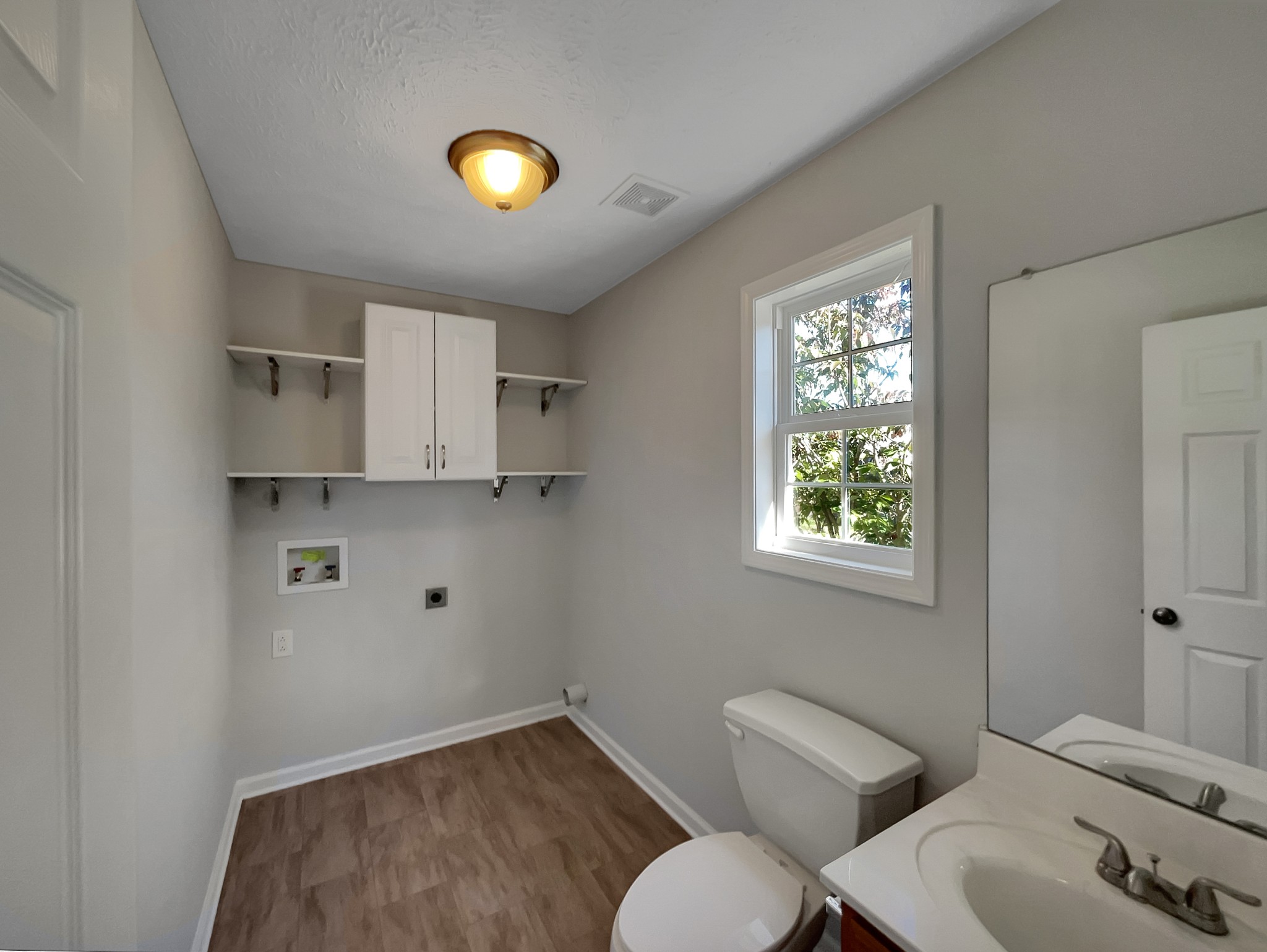 1837 Twin Rivers Road Clarksville, TN 37040 - Photo 14 of 19 a bathroom with a toilet and a sink