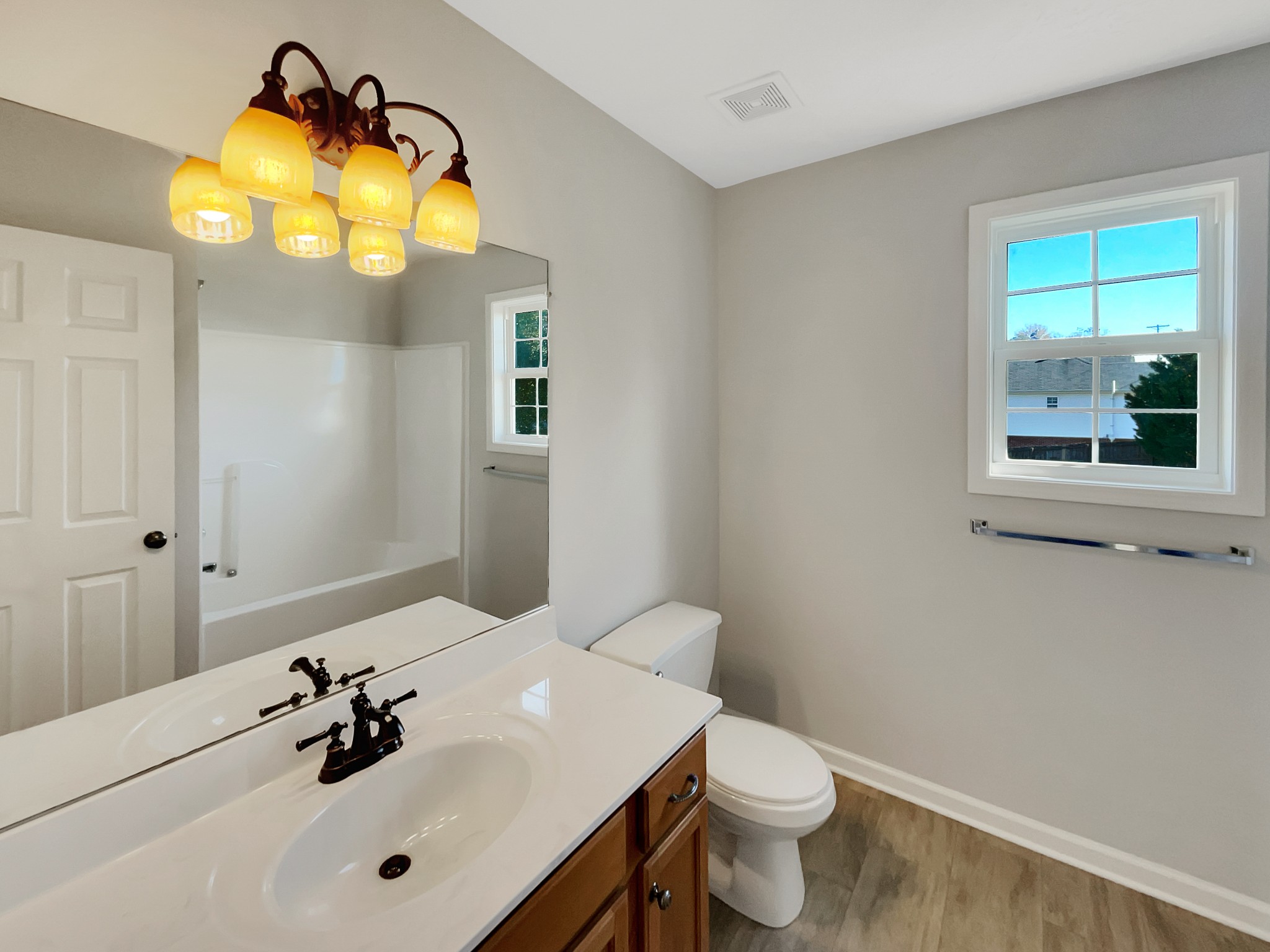 1837 Twin Rivers Road Clarksville, TN 37040 - Photo 15 of 19 a bathroom with a sink and mirror with toilet