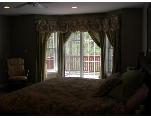 64 Sugar Road Bolton, MA 01740 - Photo 14 of 30 a bedroom with a bed and a large window