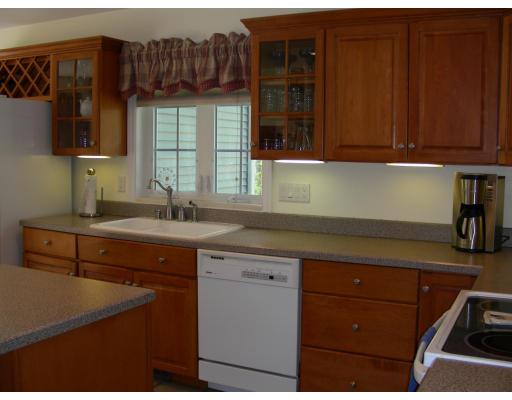 64 Sugar Road Bolton, MA 01740 - Photo 18 of 30 a kitchen with a sink and cabinets
