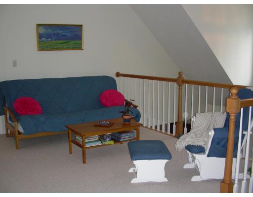 64 Sugar Road Bolton, MA 01740 - Photo 8 of 30 a living room with furniture and a book shelf