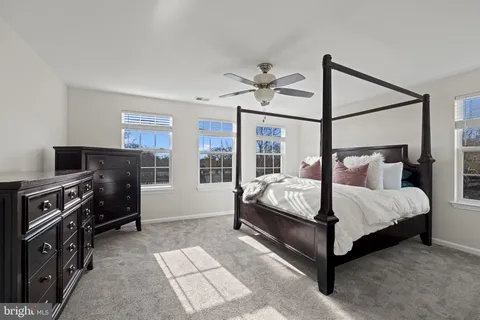 a bed room with a bed and a tv