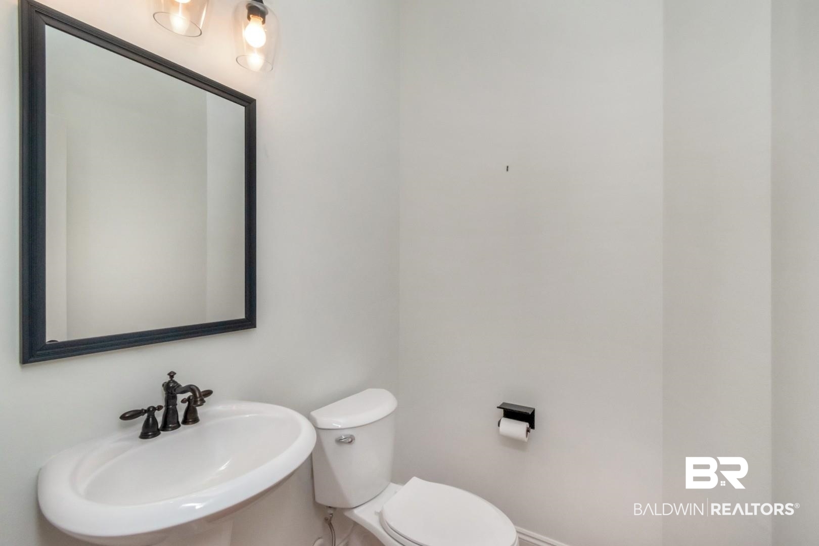 30585 Pine Court Daphne, AL 36527 - Photo 37 of 49 Half bathroom featuring a sink and toilet