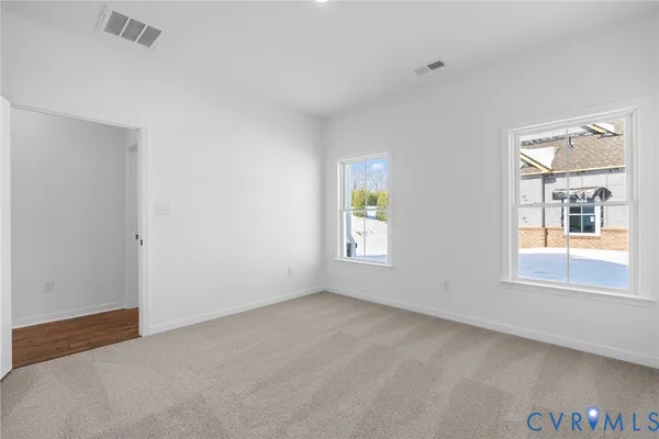 an empty room with windows