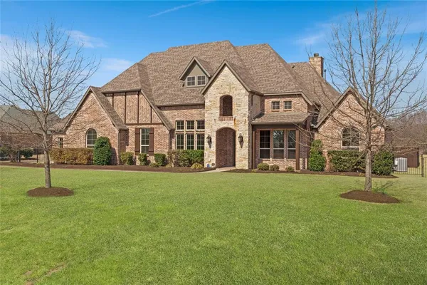 an aerial view of a house with swimming pool garden and patio