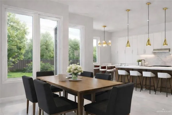a dining room with furniture a chandelier and wooden floor