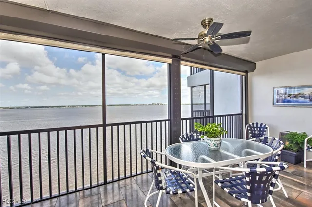 a dining room with furniture window and outside view