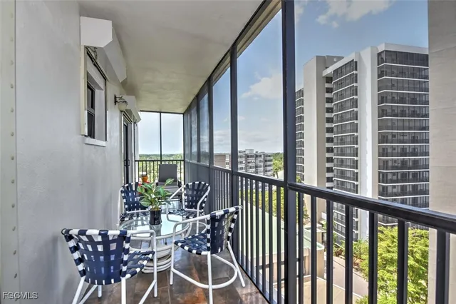 a view of a dining room with furniture and a potted plant