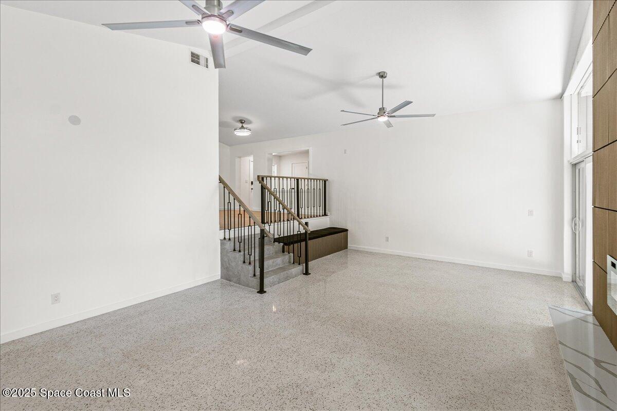 2302 Ruffner Road Melbourne, FL 32901 - Photo 25 of 80 an empty room with a ceiling fan and a window
