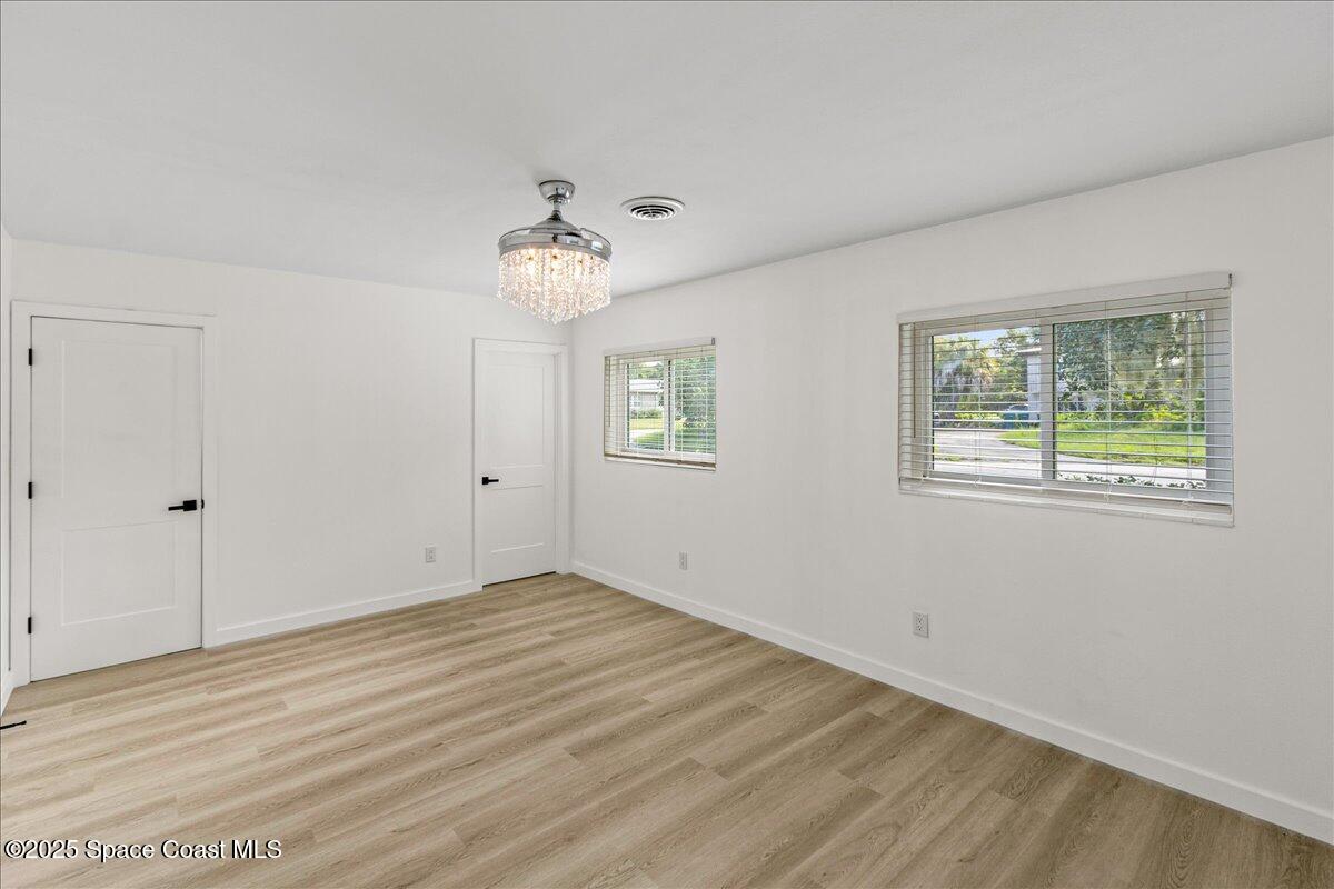 2302 Ruffner Road Melbourne, FL 32901 - Photo 29 of 80 a view of an empty room with a window