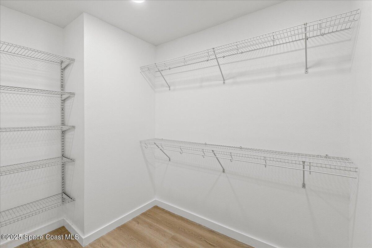 2302 Ruffner Road Melbourne, FL 32901 - Photo 33 of 80 a view of storage and utility room with racks on the wall
