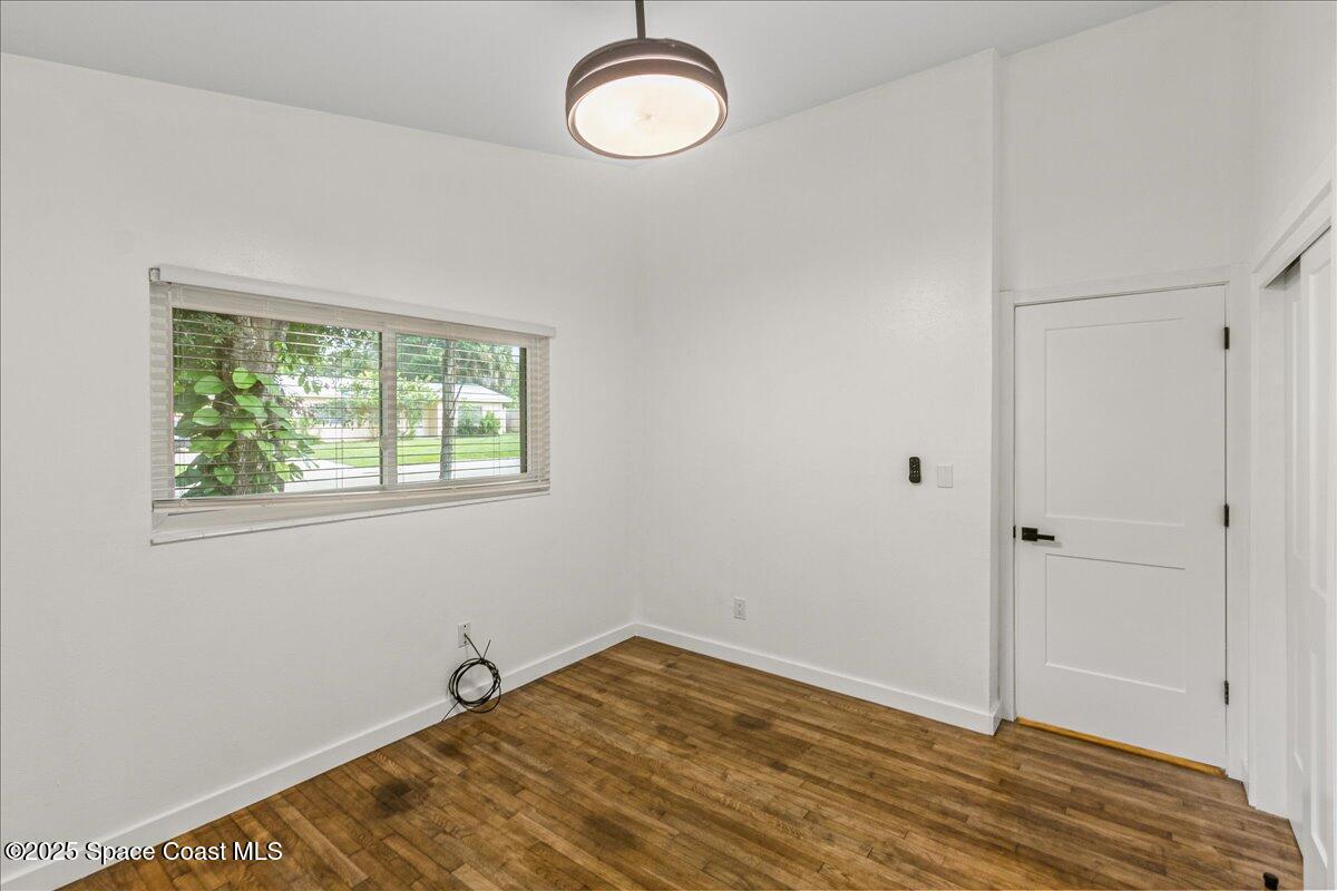 2302 Ruffner Road Melbourne, FL 32901 - Photo 38 of 80 a view of a room with wooden floor and window